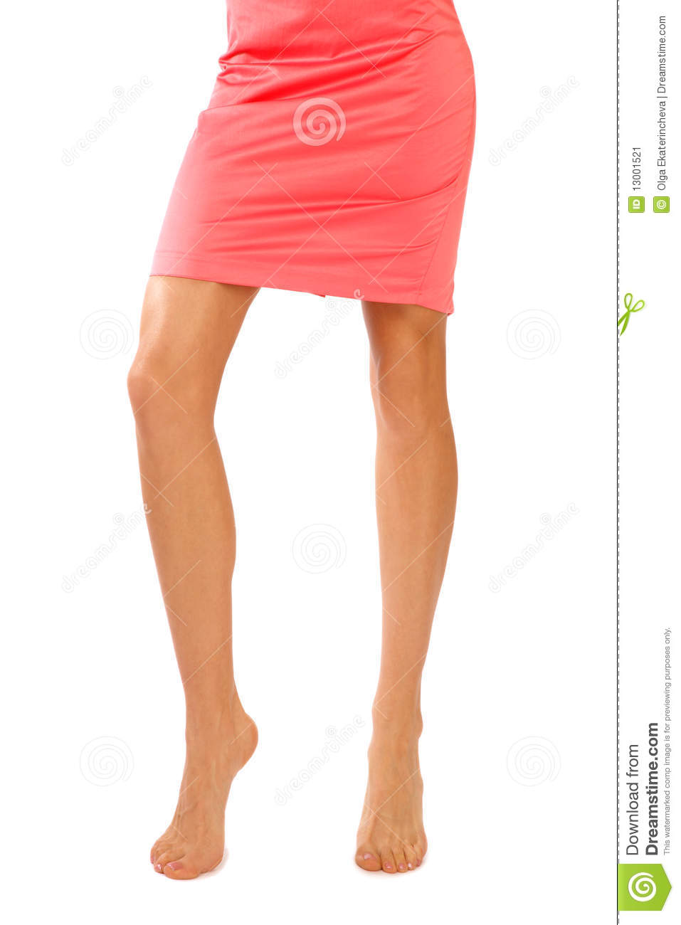 Slim Legs Of Tanned Sexy Barefoot Woman In Coral Dress On White