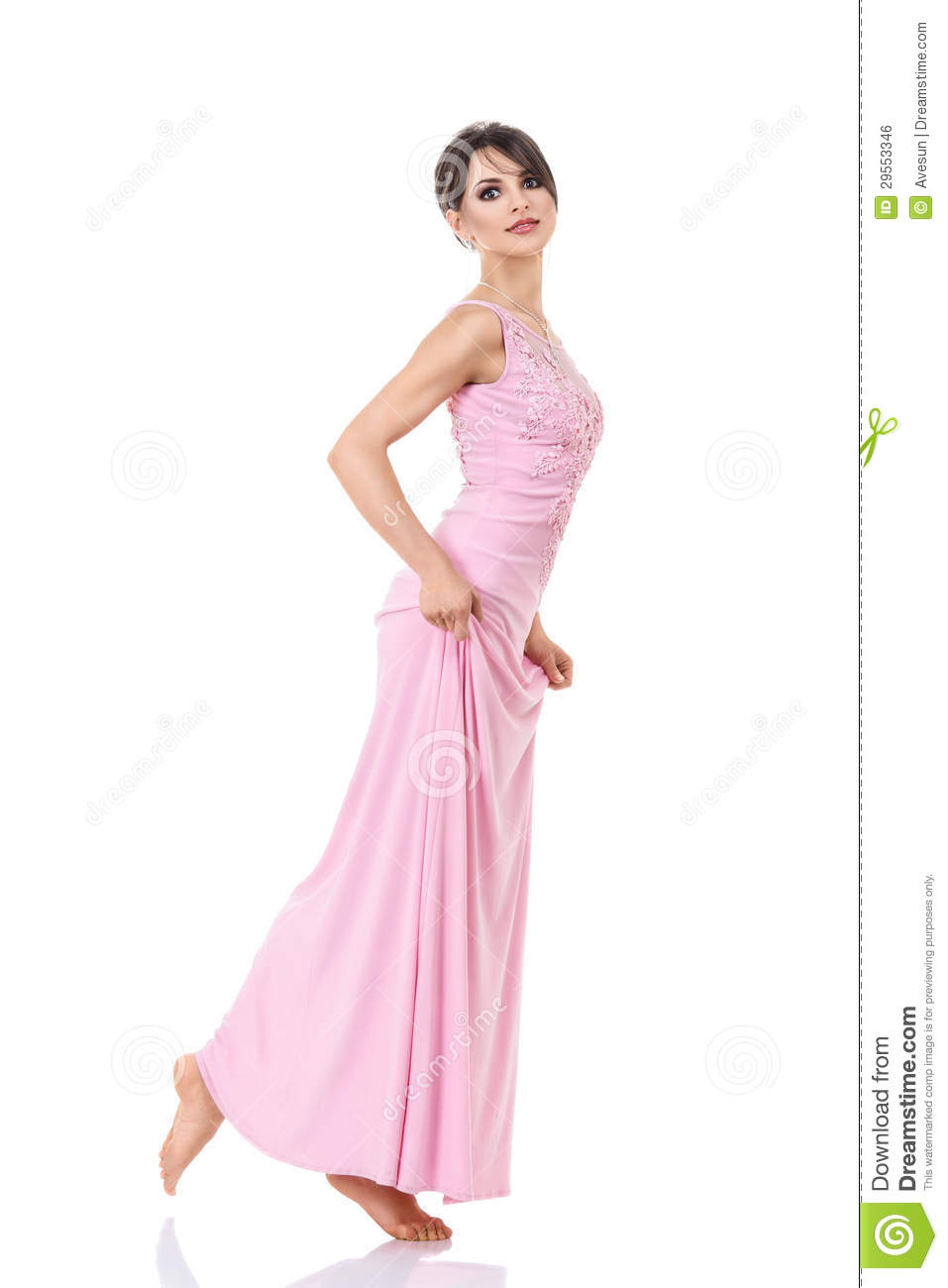 Young Sexy Barefoot Woman In Long Pink Dress Goes Tiptoe Isolated Over