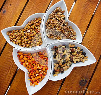 Different Kinds Of Nuts As A Salty Snack With Olives And Pepper