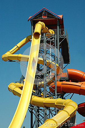 Tall Two Story Slide Ride At A Water Park With Person In Motion Coming