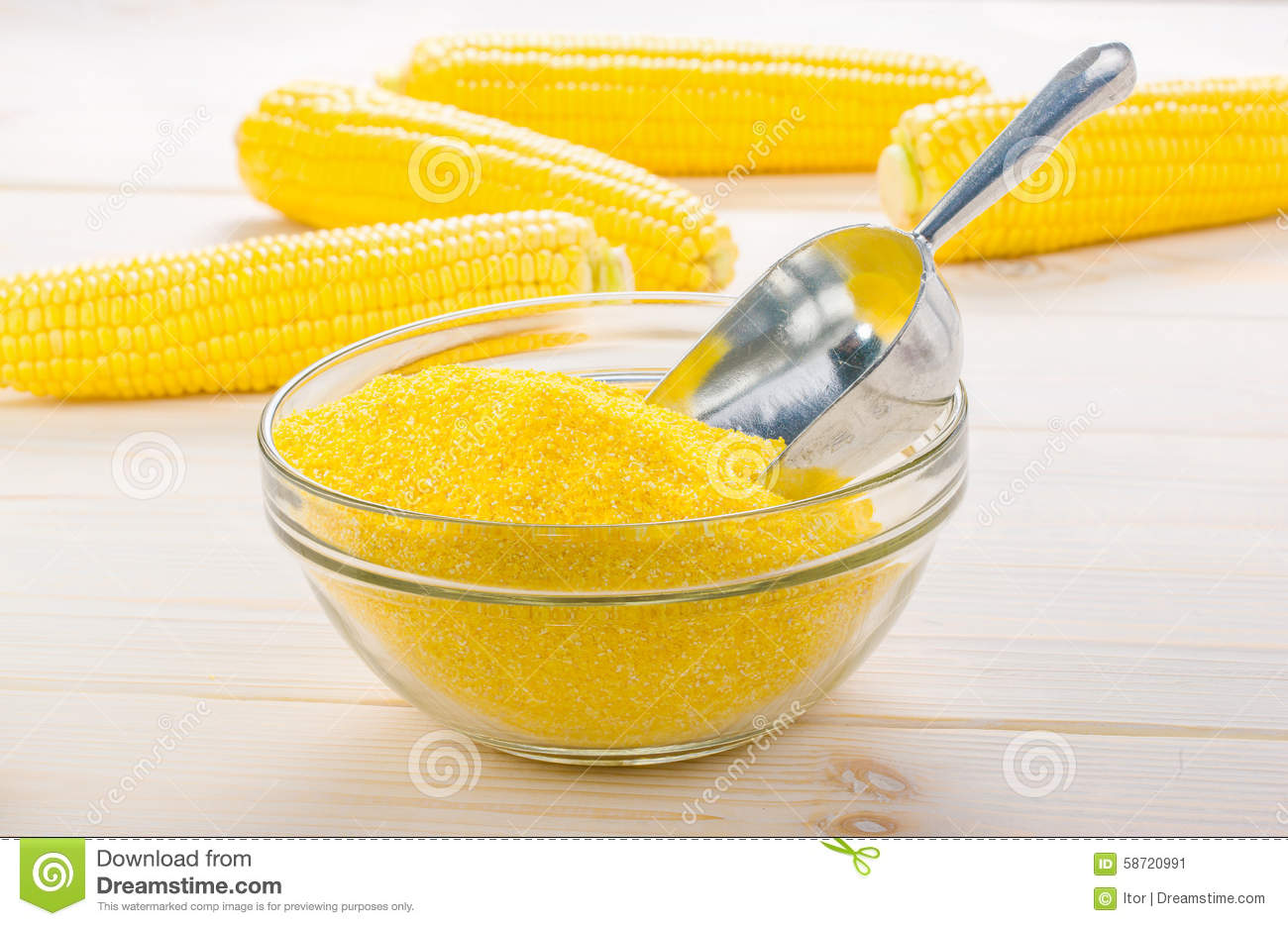 Corn Grits In A Transparent Plate With Ears Of Corn On The Wooden    