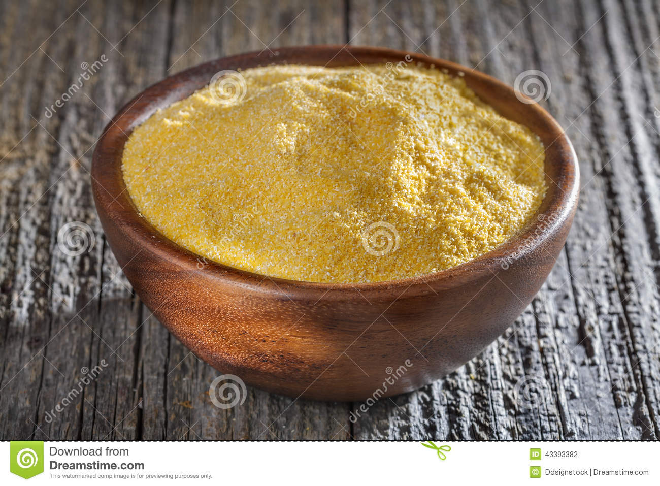 Corn Grits Polenta In A Wooden Bowl On Old Wooden Table