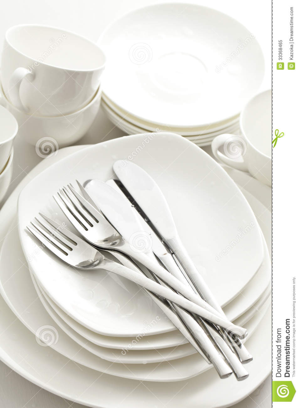 Image Of Kitchen Cutlery And Dishes Piled