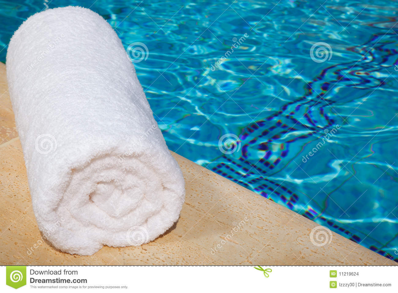 One Rolled Up White Towel By Blue Pool Stock Images   Image  11219624