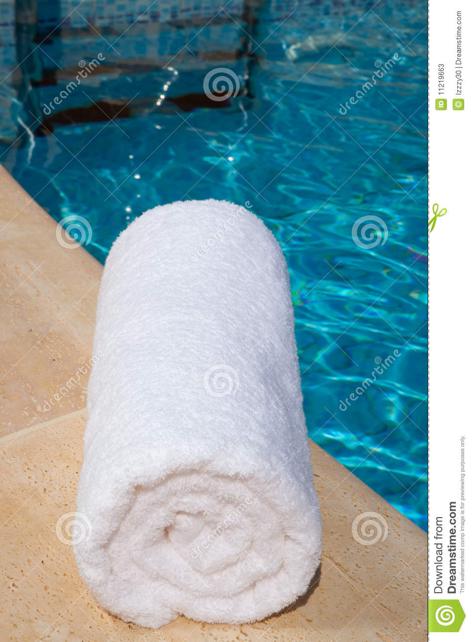 One Rolled Up White Towel By Blue Pool Stock Photos   Image  11219663
