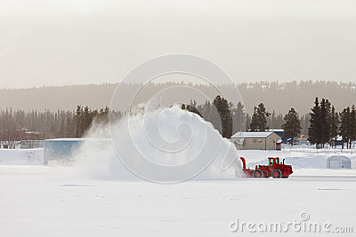 Snow Blower Clearing Road In Winter Storm Blizzard Royalty Free Stock