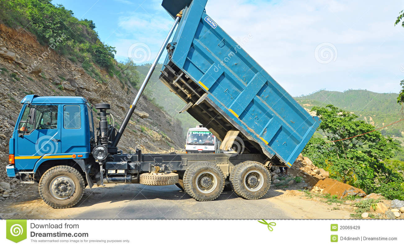Truck Clearing Dumping Broken Rock Pieces On The Road In Uttrakhand