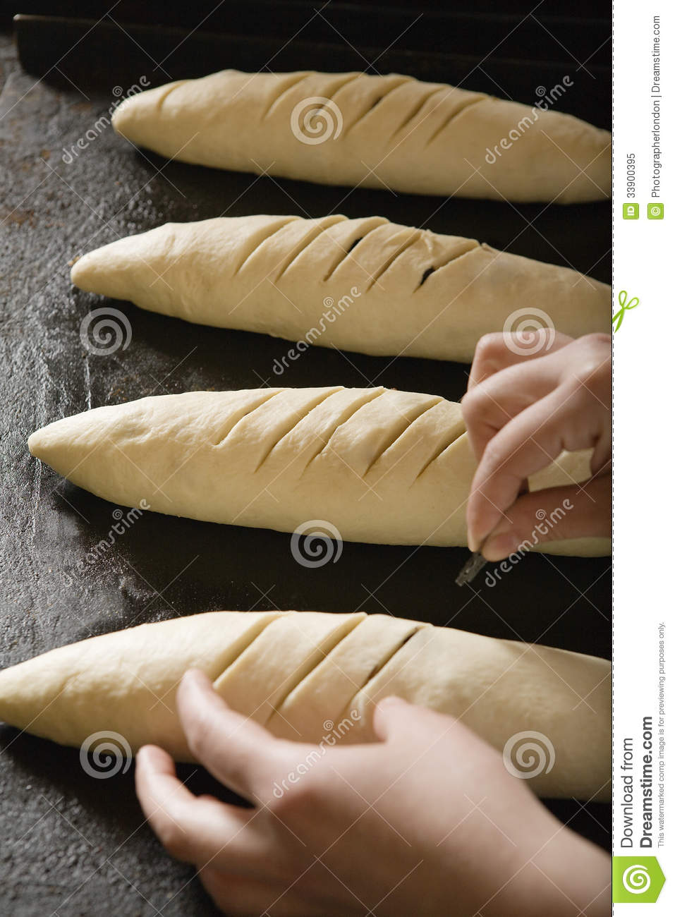 Baker Scoring Loaves Of Bread Dough Royalty Free Stock Photo   Image    