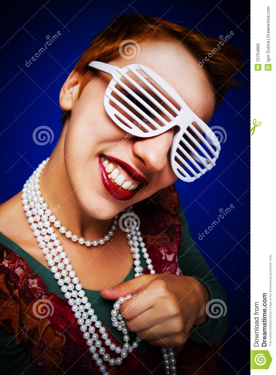 Beautiful Smiling Girl Wearing Shutter Shades And Pearl Necklace 