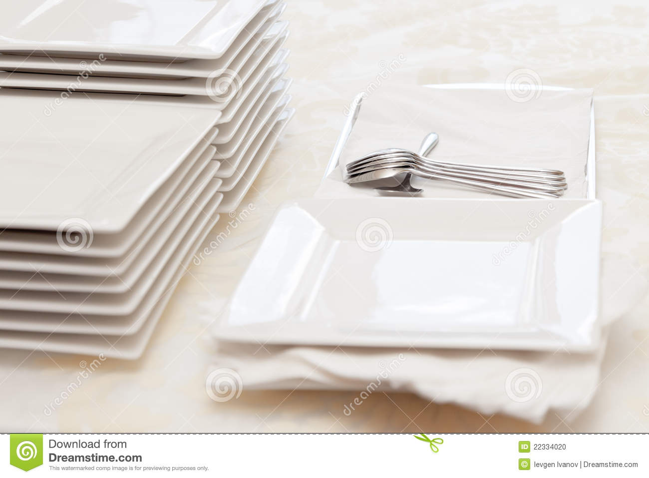 Stack Of Square White Plates And Silver Spoons At A Catered Buffet