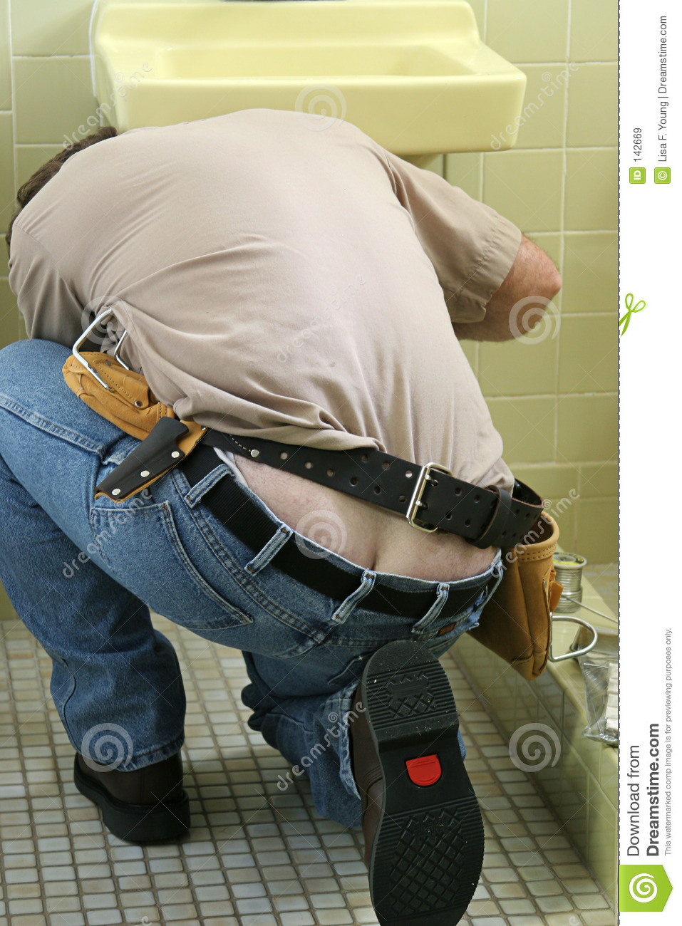 Plumber Bending Over To Fix A Sink  His Butt Crack Is Showing