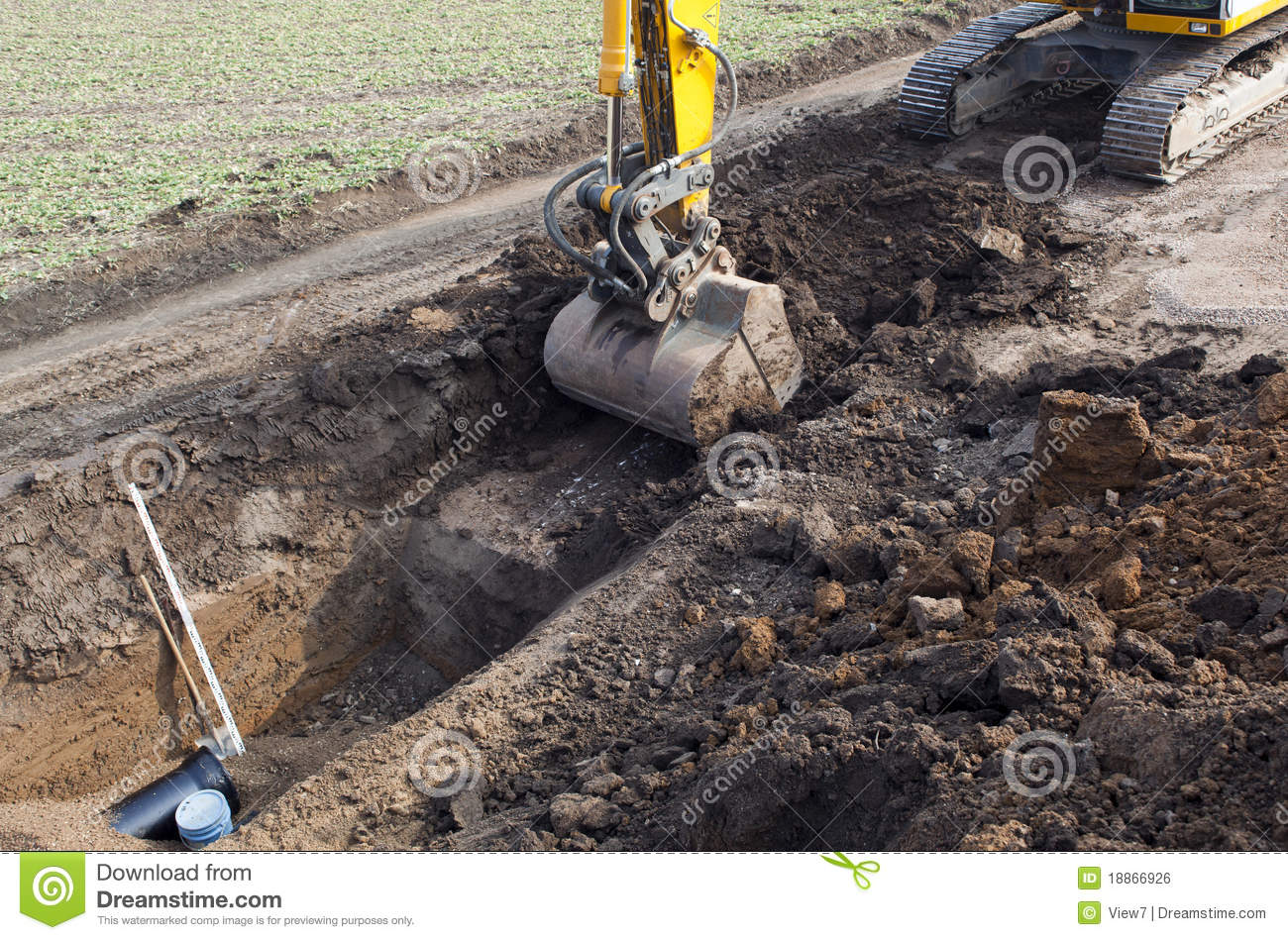     Of Modern Excavator Digging Trench On Building Or Construction Site