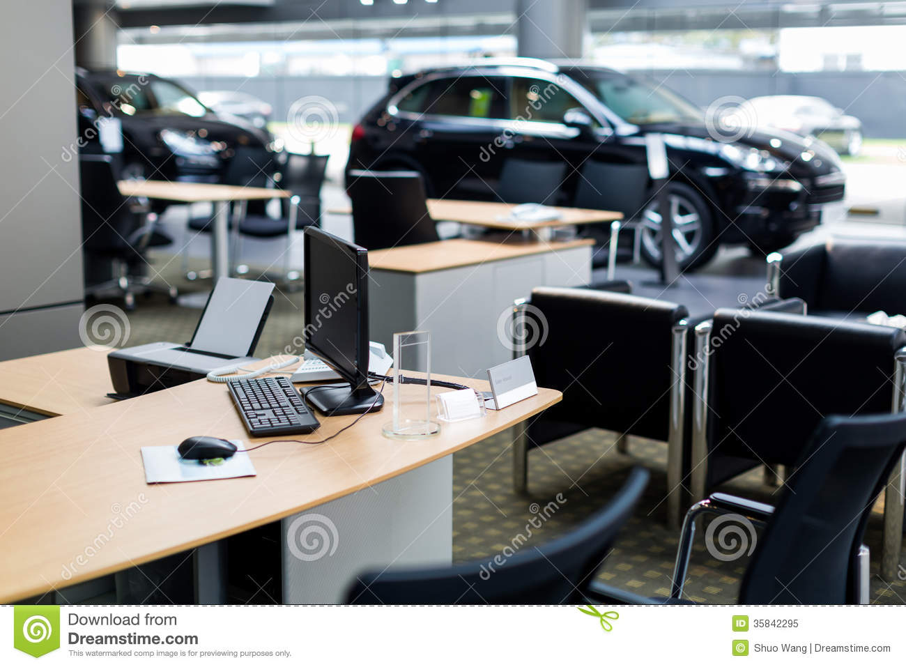 Car At Car Dealership Showroom Reception Desk