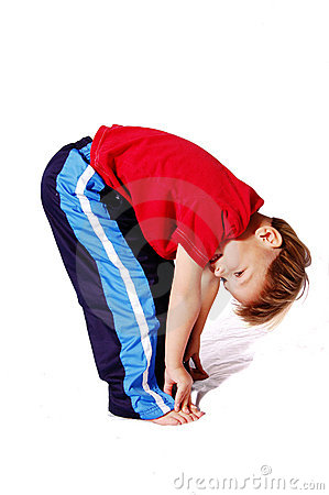 Boy Wearing Red And Blue Who Is Bending Over And Touching His Toes