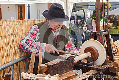 Recalling Of Ancient Craft  An Artisan Working The Wood With An
