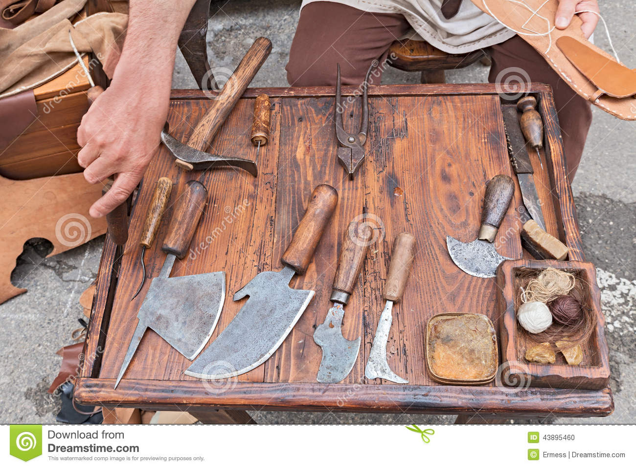 Work Table With Old Tools Of The Artisan Shoemaker For Cutting And