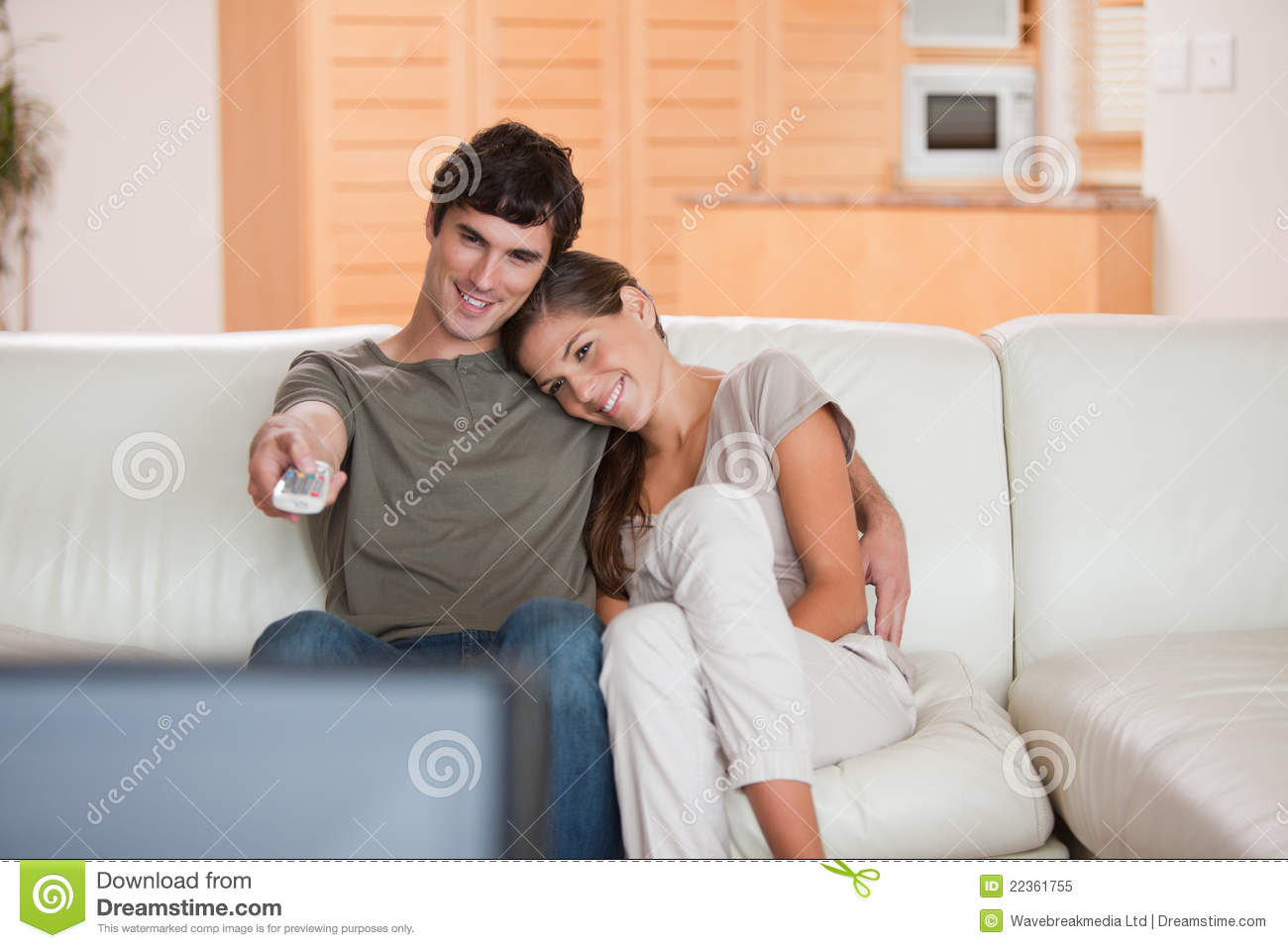Couple On The Couch Watching Television Together Royalty Free Stock