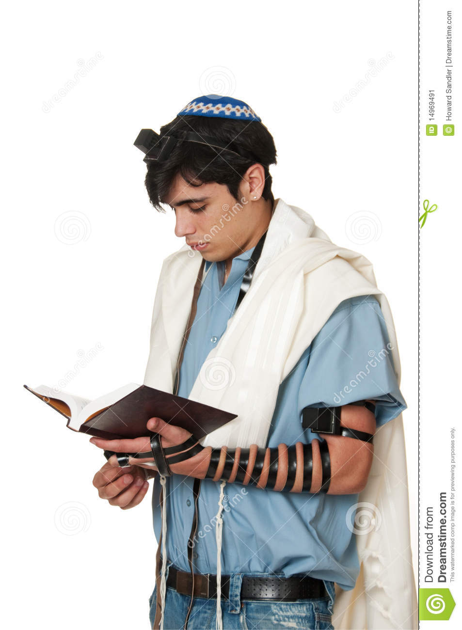 Young Sephardic Jewish Man In Tallit And Tefillin Does Morning Prayers