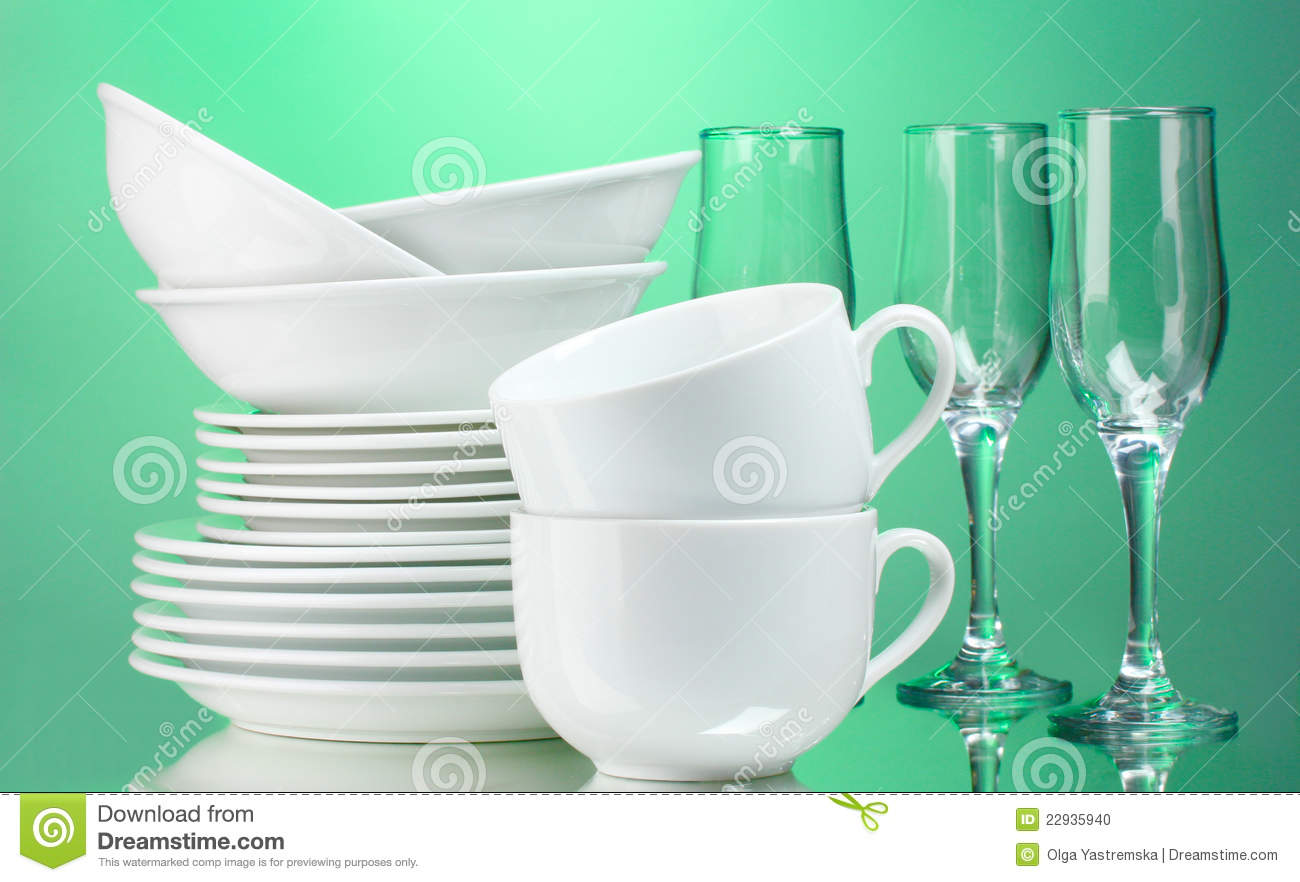 Clean Plates Cups And Glasses On Green Background
