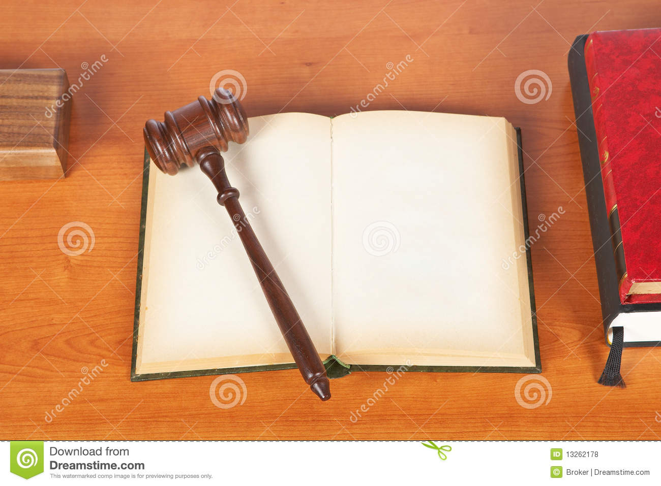 Wooden Gavel From The Court And Opened Law Book On Wooden Background