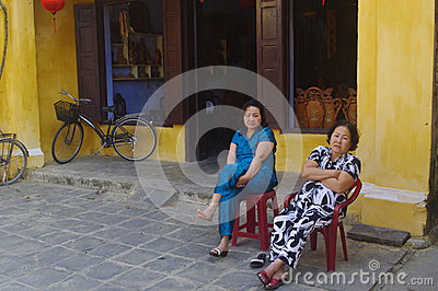 Vietnamese Women Having Relaxing Rest In Colonial Town Of Hoi An