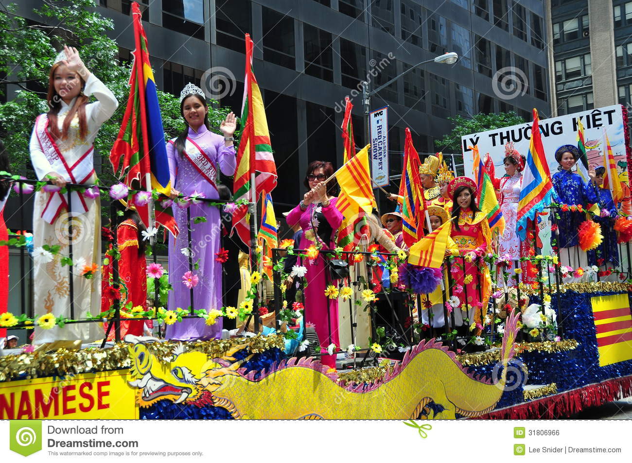Vietnamese Women Riding On A Float At The International Immigrants