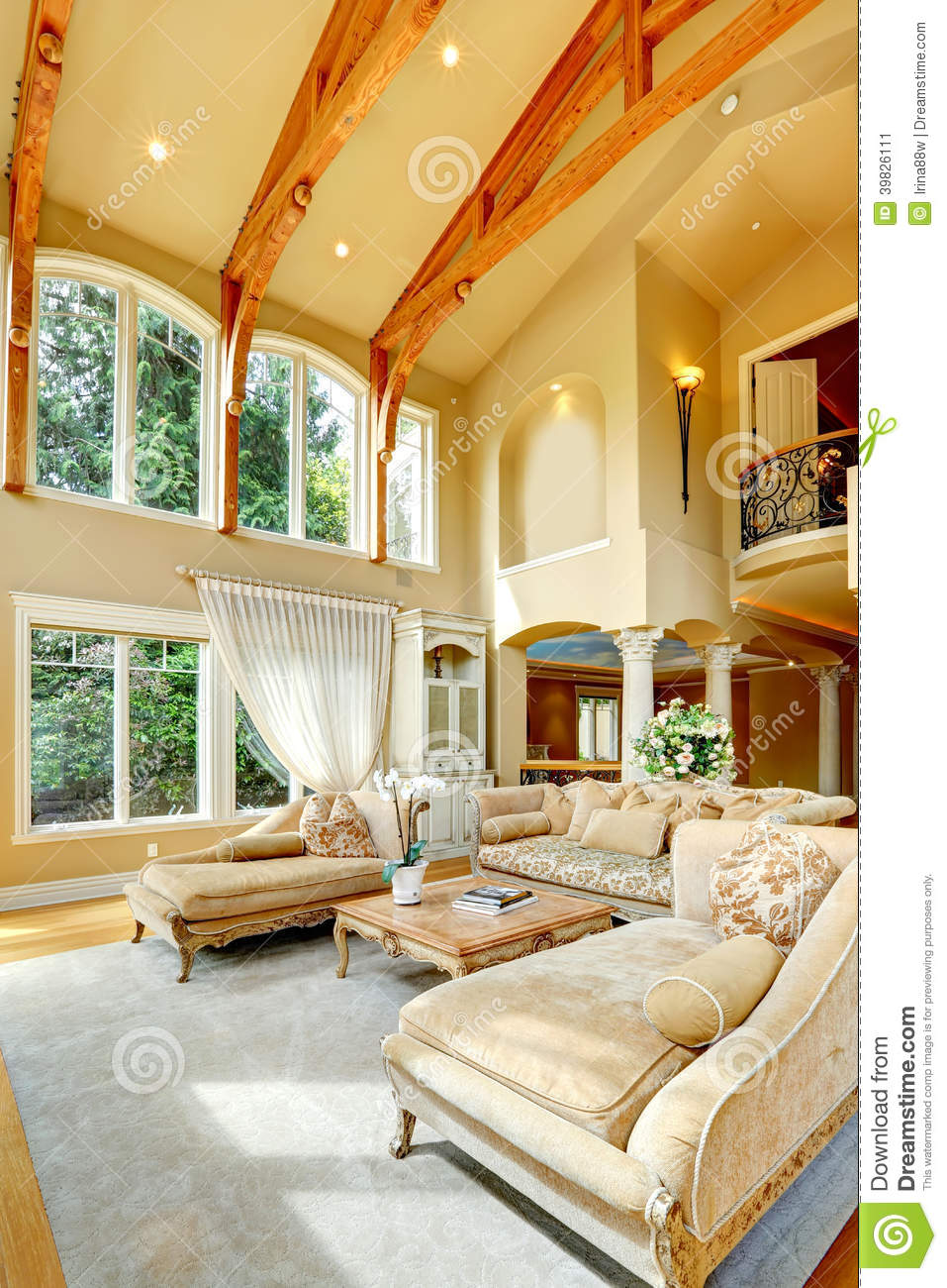     Living Room With High Ceiling Antique Furniture Columns And Balcony