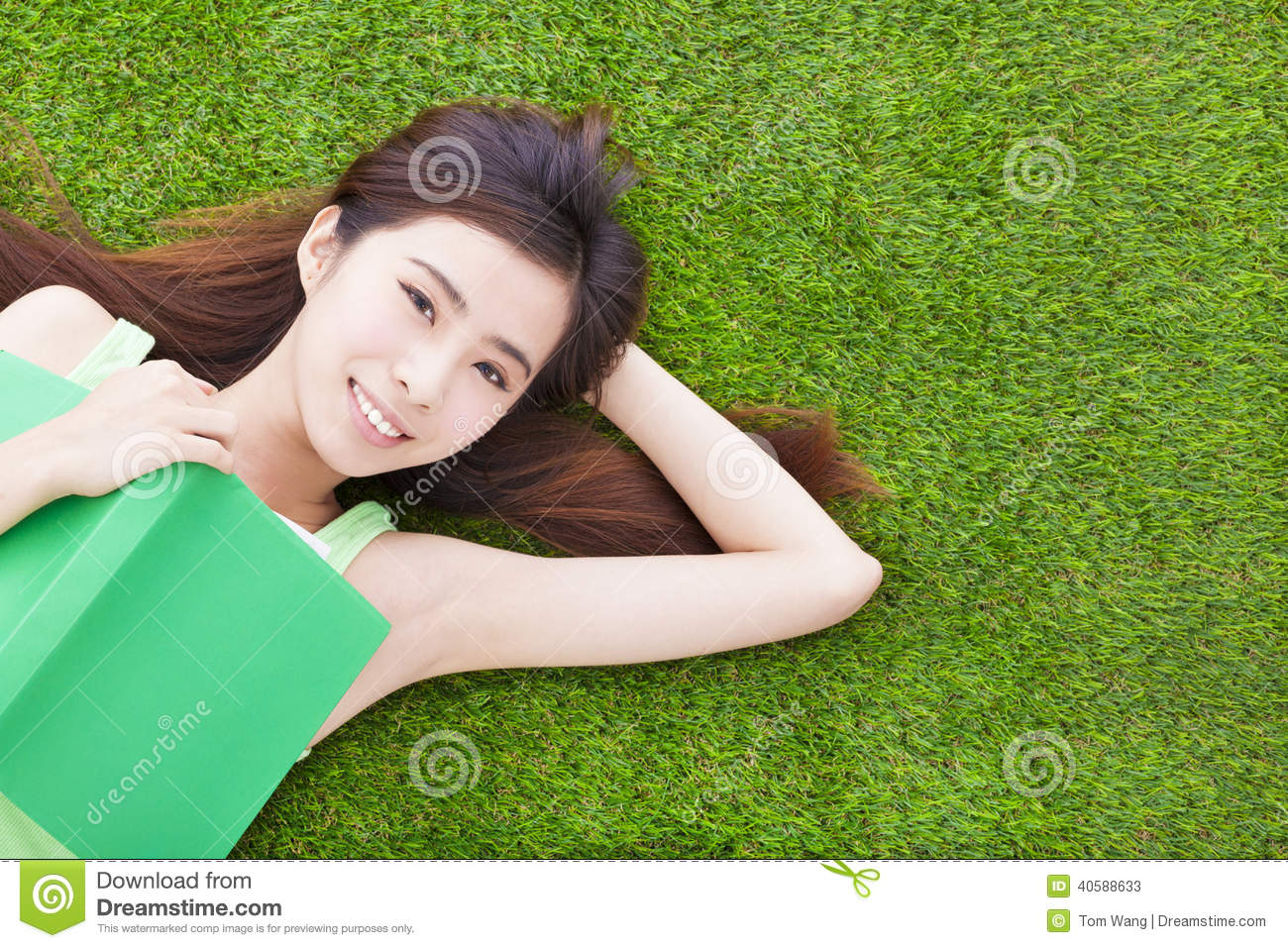 Smiling Girl Student Laying Down On A Meadow Stock Photo   Image    