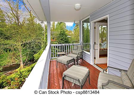 Stock Photo Of Balcony With Outdoor Furniture And View Of Woods And