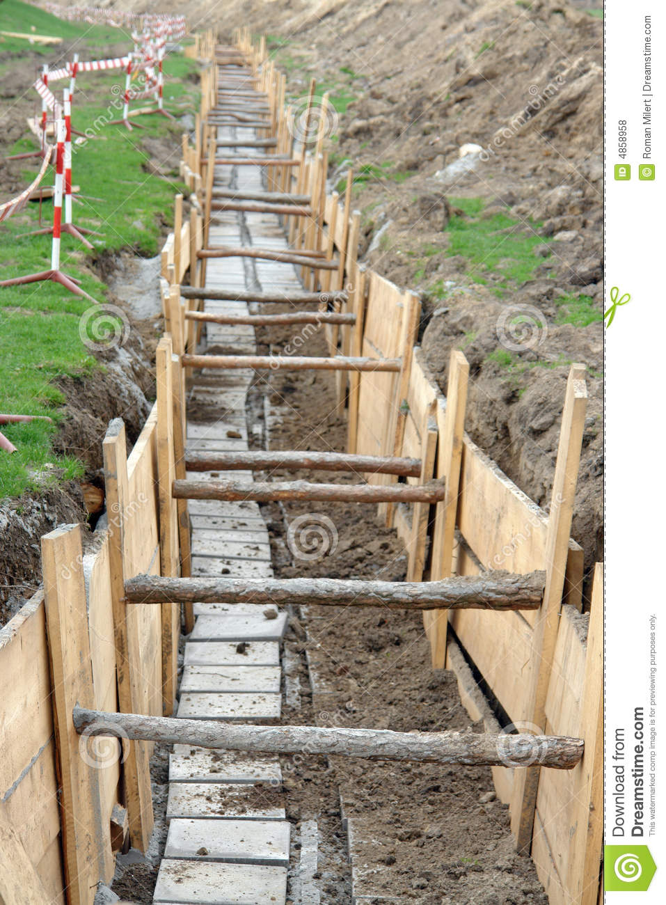 Long Earth Excavation Protected On Two Sides By Wooden Shuttering