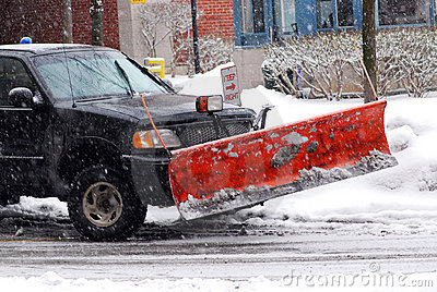 Snow Plow Truck On A Road During A Snowstorm