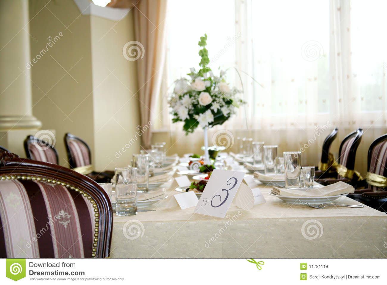 Elegant Tables And Chairs Set Up For A Wedding Banquet