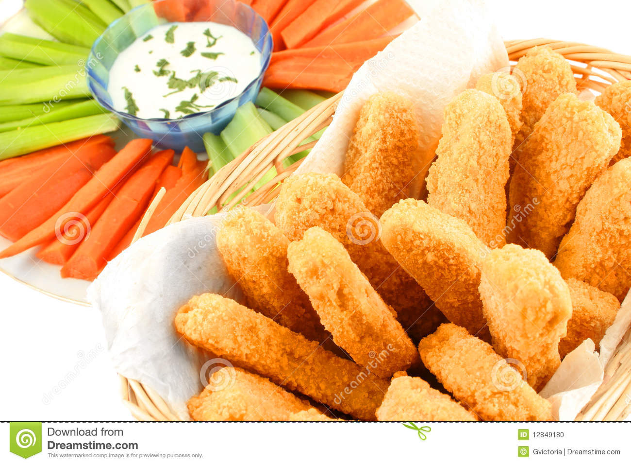 Basket Of Crispy Chicken Fingers With Platter Of Vegetables And Dip