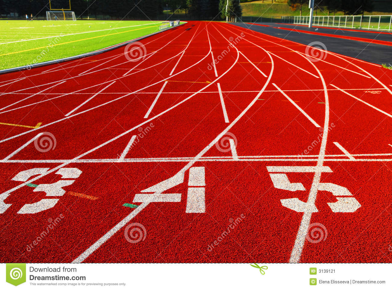 Lanes Of A Red Race Track With Numbers And Green Football Field