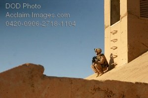 Free Public Domain Picture  Soldier Sitting On The Roof Of A Building