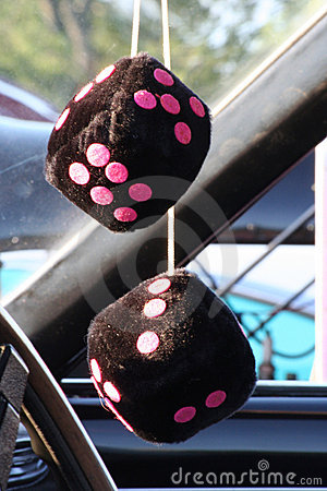 Set Of Black Fuzzy Dice With Hot Pink Dots Hands On A Classic Car
