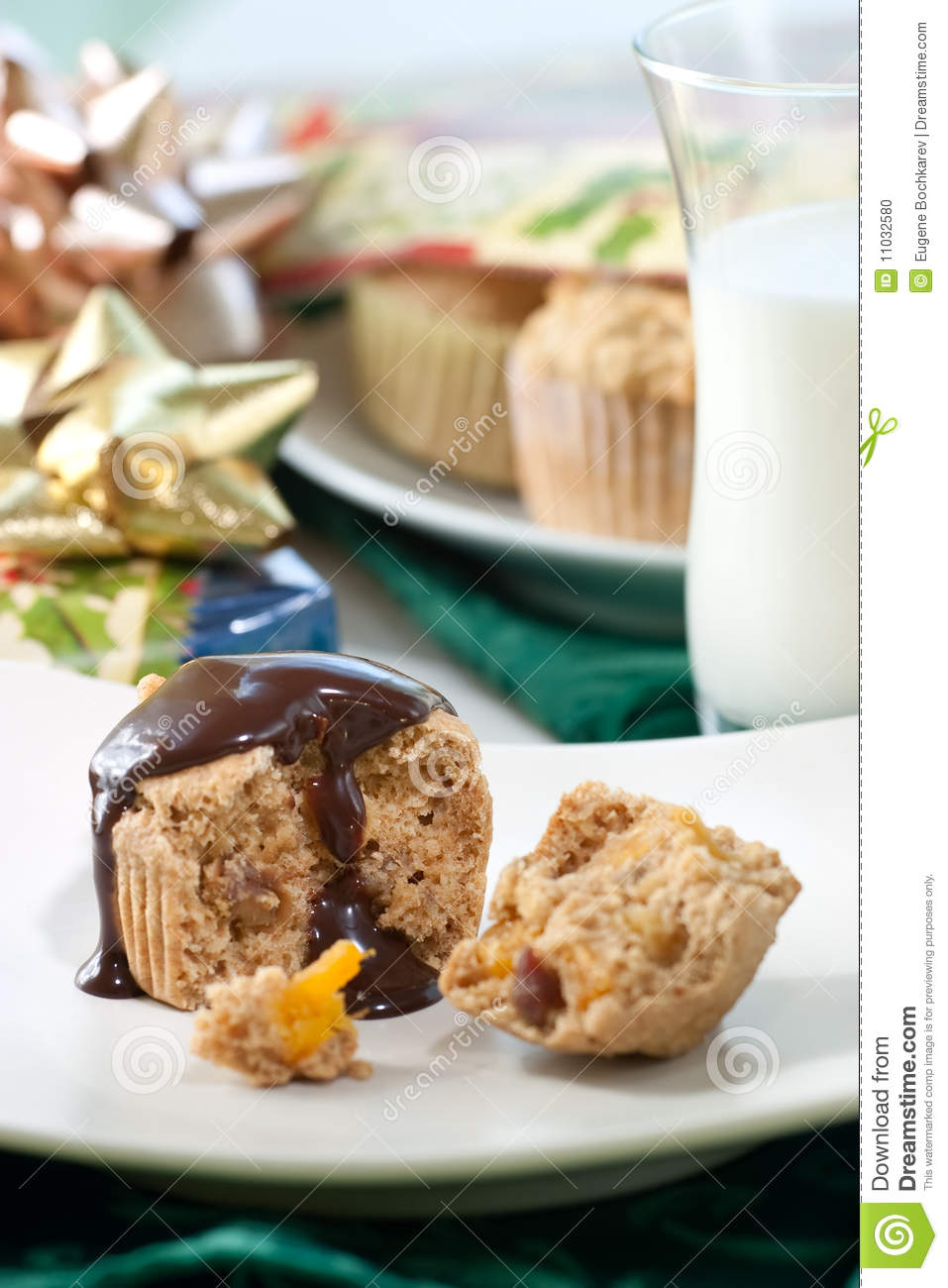 Whole Grain Muffins With Chocolate Sauce Surrounded By Holiday Wrapped