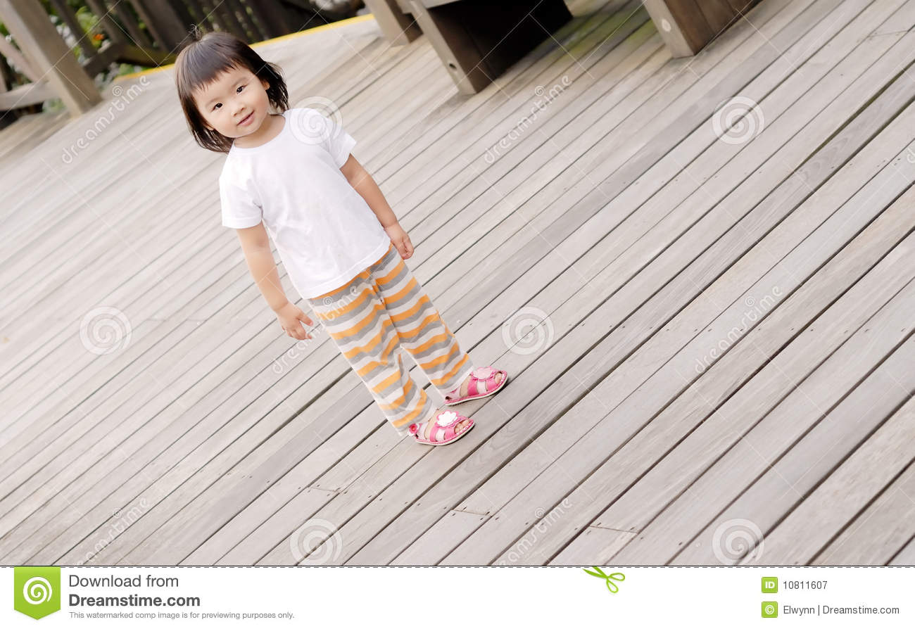 Children Stand On The Wood Ground Royalty Free Stock Photography