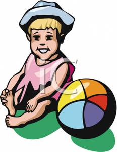 Toddler Sitting By A Beach Ball Playing With Her Toes   Royalty