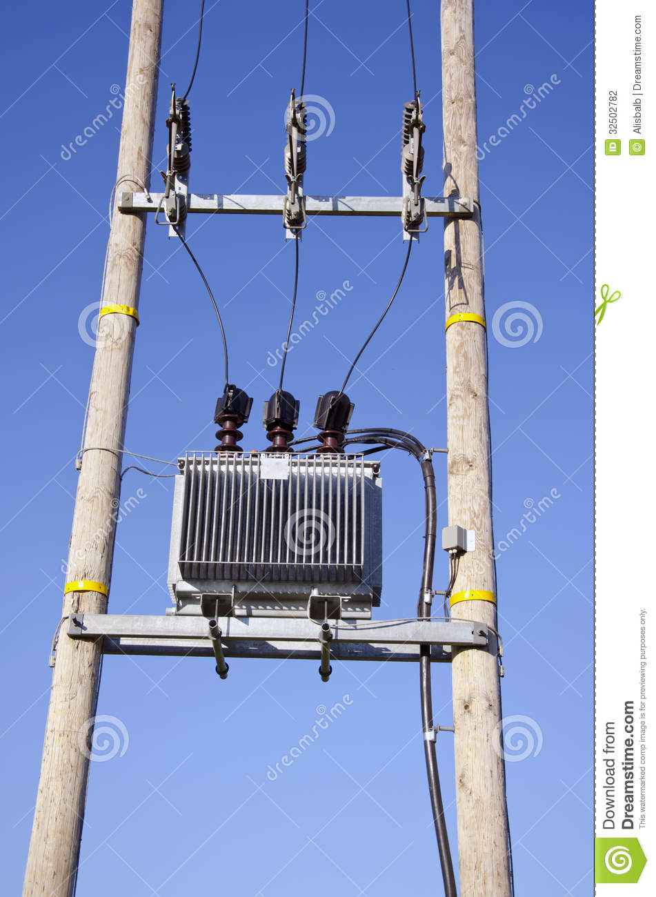 Wooden Utility Pole With Power Lines And Transformer On Sky Stock