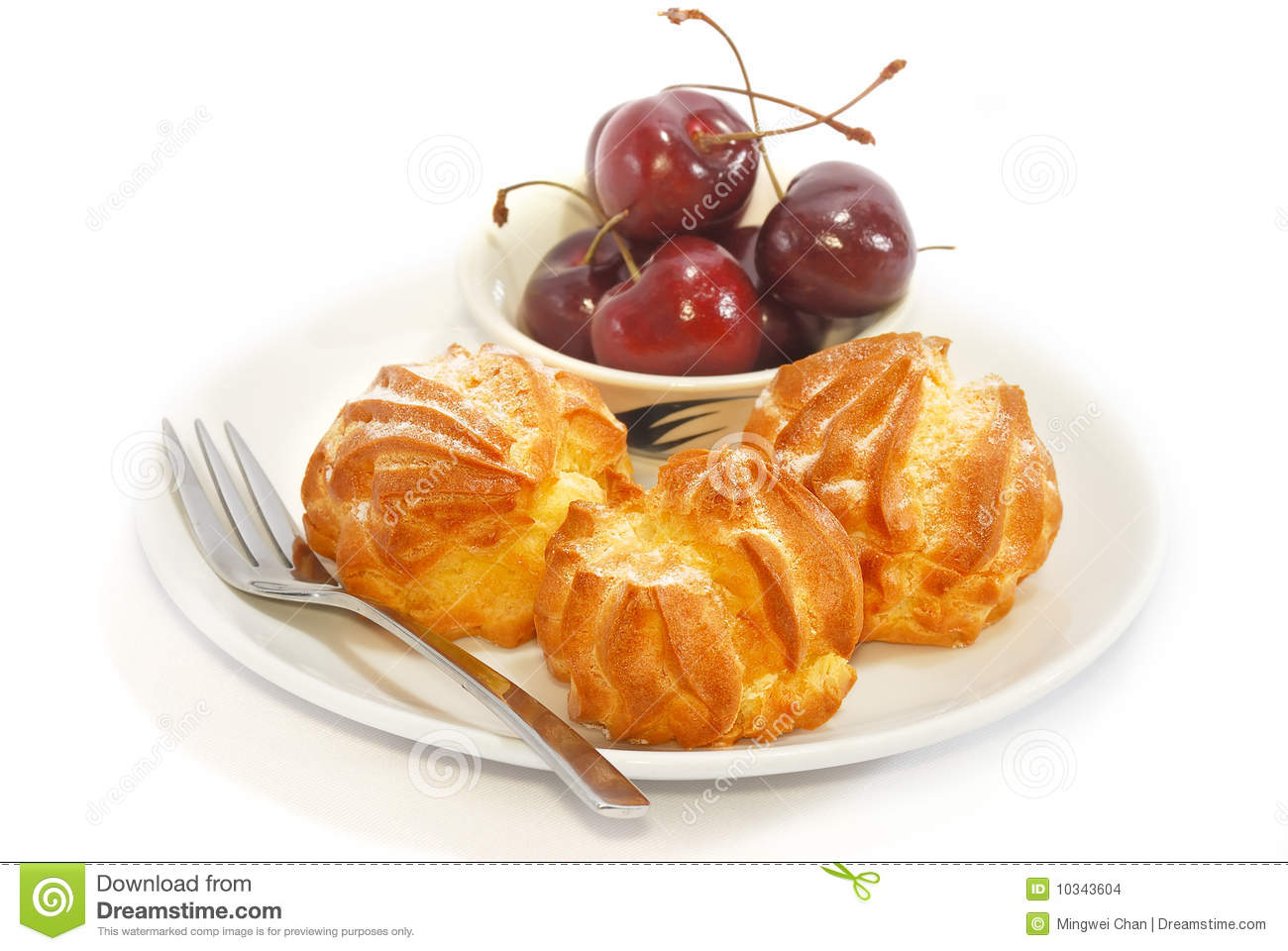 Cream Puff And Fresh Cherry On Plate With White Background 