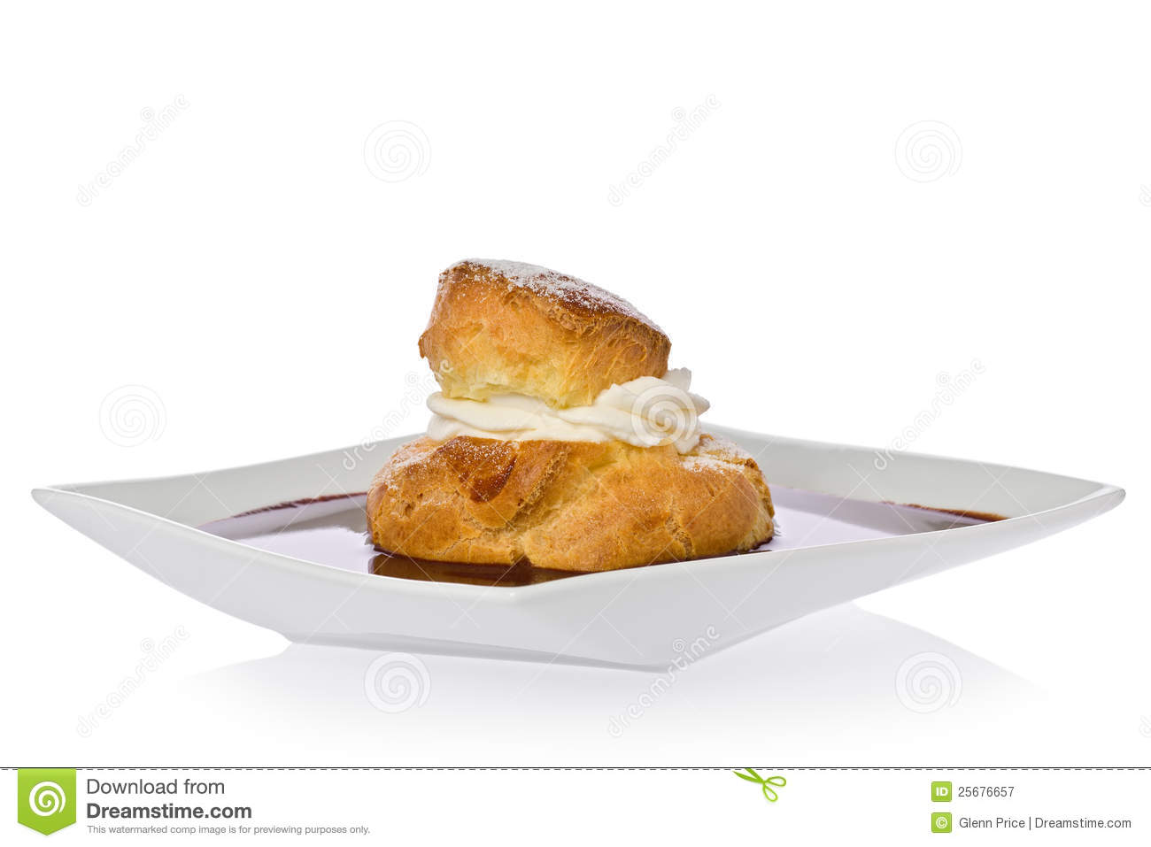 Cream Puff With Raspberry Filling In A Chocolate Sauce On A Square    