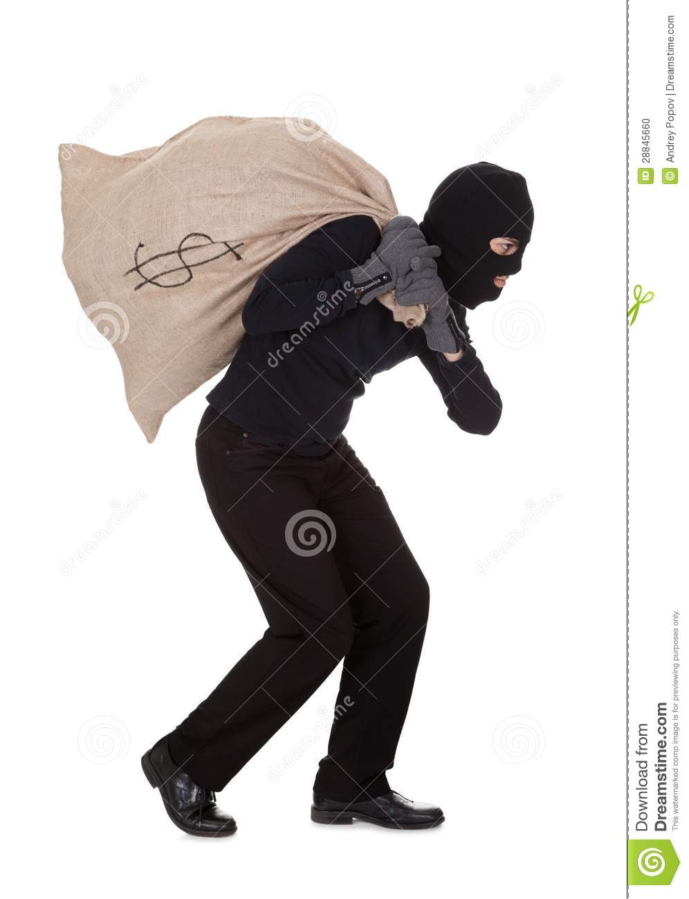 In Black Clothes Wearing A Balaclava Carrying A Large Bag Of Money    