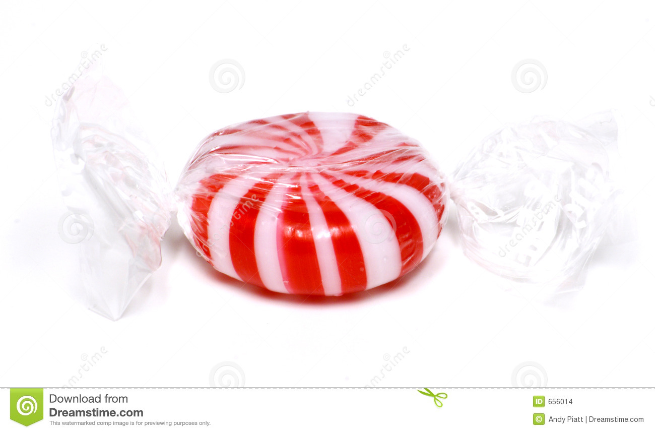Striped Peppermint Hard Candy In A Clear Plastic Wrapper And Isolated
