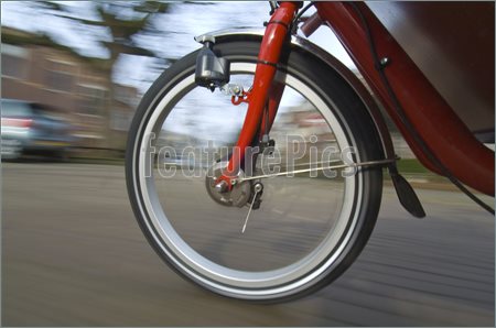 Image Of The Spinning And Vibrating Wheel Of A Delivery Bicycle On A