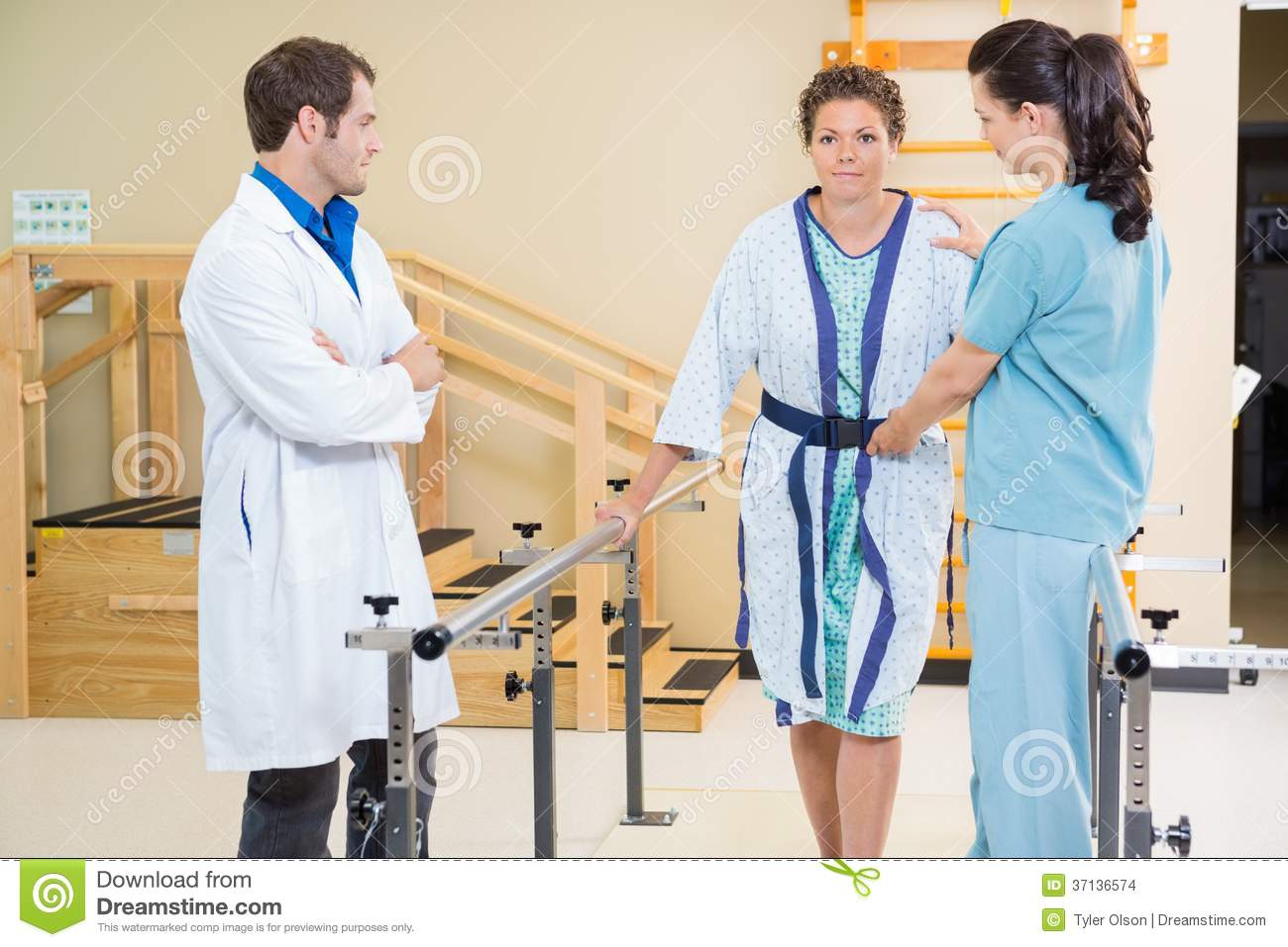 Physical Therapist With Doctor Assisting Female Stock Images   Image