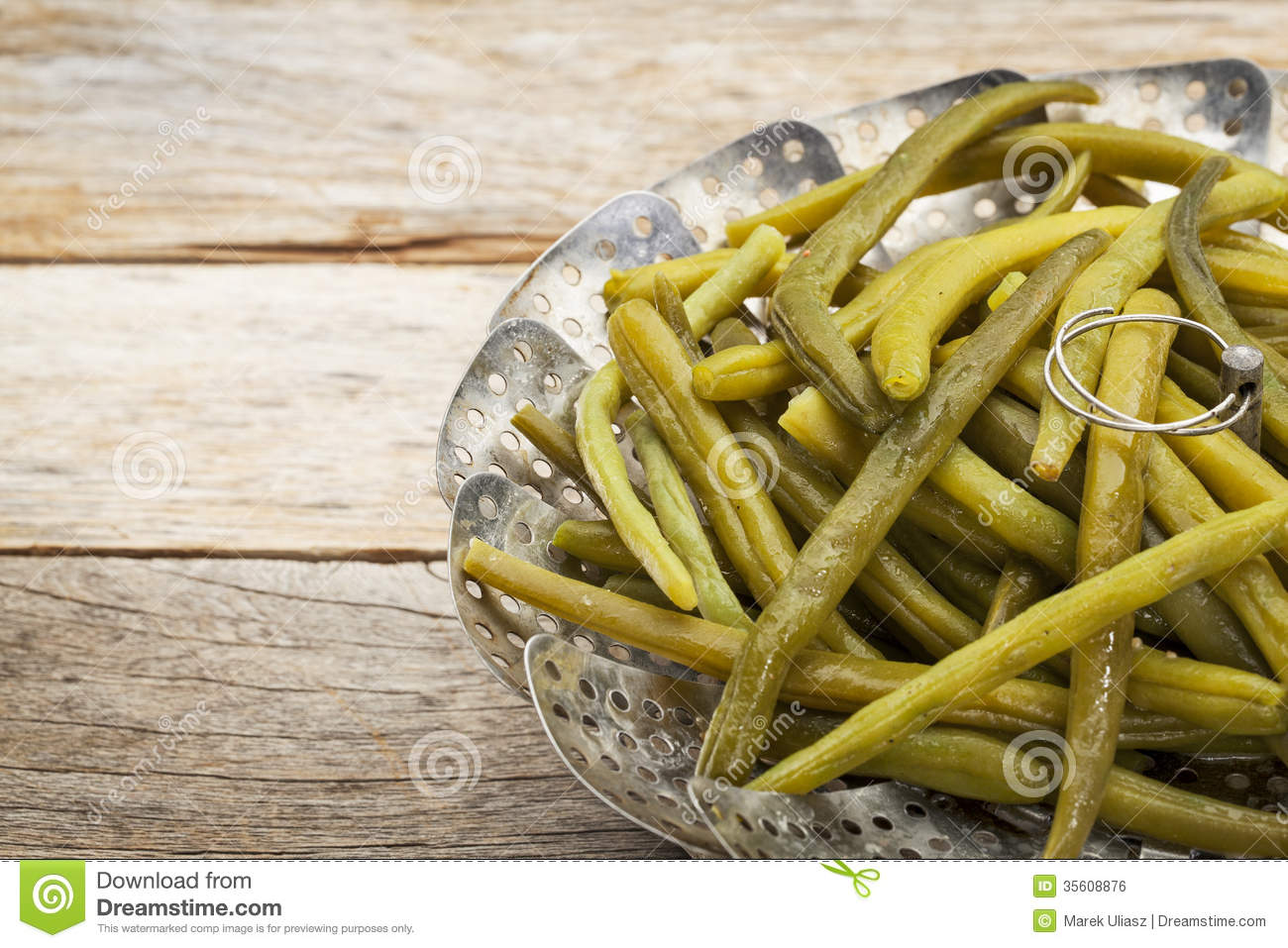 Cooked Green  French  Beans With Butter In A Metal Steamer Basket On A