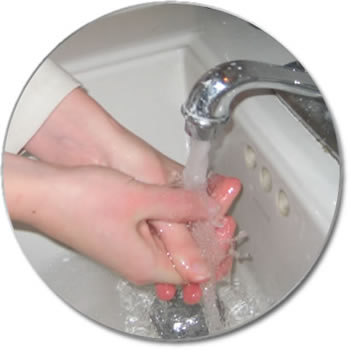 Image Of Hands Underneath Running Water From A Faucet