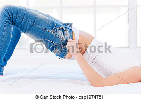 These Jeans Are Too Tight  Cropped Image Of Young Blond Woman Lying On