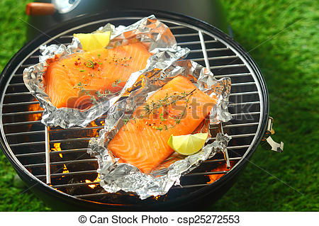 Delicious Fresh Salmon Fillets Grilling On An Open Fire In A Portable